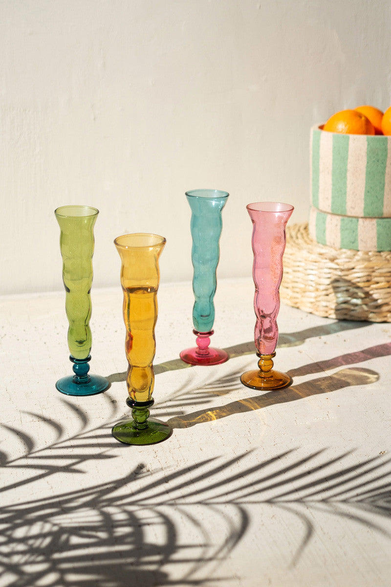 SET OF FOUR GLASS TRUMPET VESSELS - ONE EACH COLOR