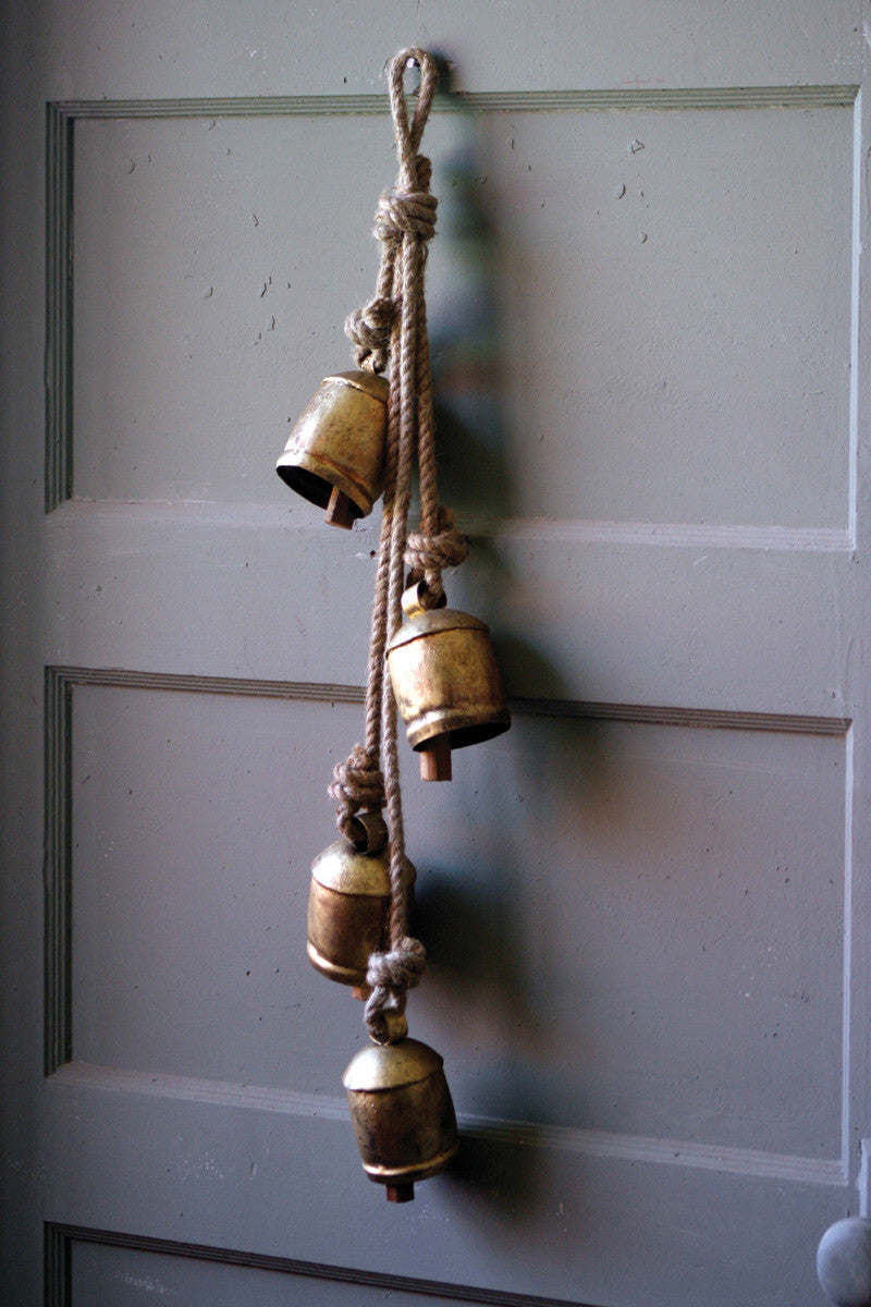 FOUR RUSTIC IRON HANGING BELLS WITH ROPE